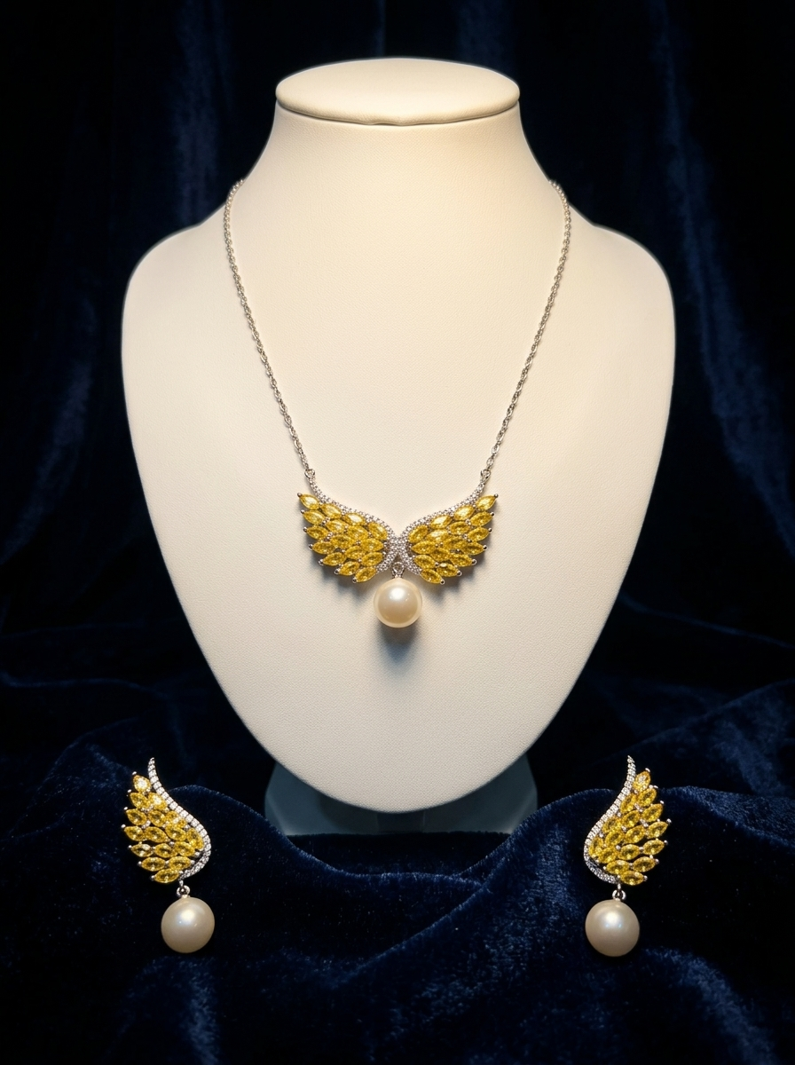 Angel Wing Pendant & Earring Set hero — white showroom bust against midnight navy velvet, citrine marquise wings with pearl drop centerpiece
